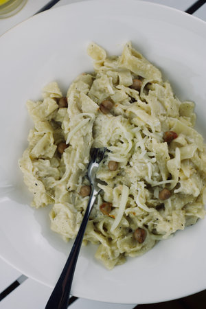 Delicious and fresh tasty italian pasta on the white plate. Food concept.