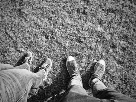 Couple walking on the grass. Spring walking concept.の写真素材