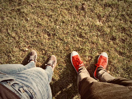 Couple walking on the grass. Spring walking concept.の写真素材