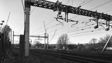 Railway bridge with electric cables near the train station. Transport concept.の写真素材