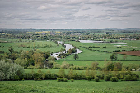 Green fields on spring time in England. Outdoor nature concept.の写真素材