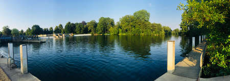 Green tree and water gate in Reading. River water concept.の写真素材
