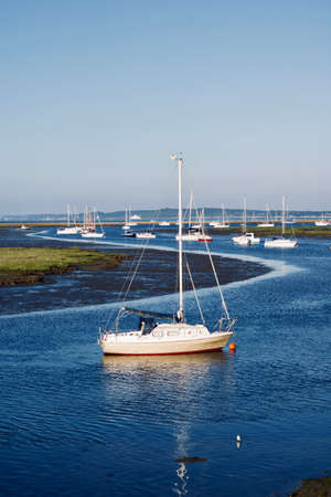 Blue water near the ocean. Boats on the water. Summer concept.の写真素材