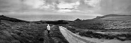 Human near Durdle Door Beach with fantastic rock & cliffs. Nature on the beach. Dorset, England.の写真素材