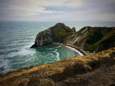 Durdle Door Beach with fantastic rock & cliffs. Nature on the beach. Dorset, England.