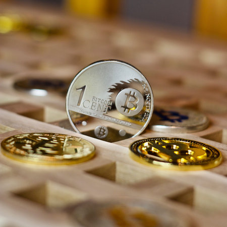 Digital currency physical metal bitcoin coin. Cryptocurrency business concept.