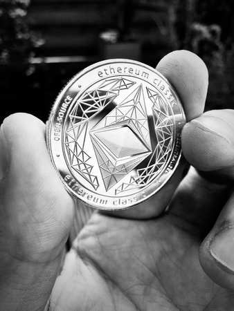Digital currency physical metal silver ethereum coin. Cryptocurrency money concept.のeditorial素材