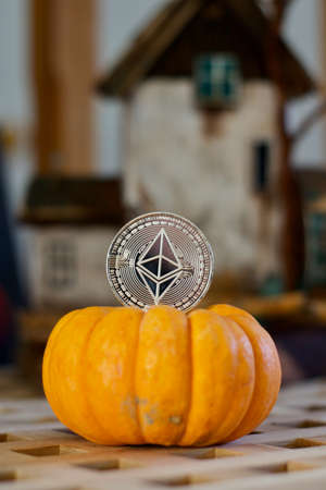 Digital currency physical metal ethereum coin. Halloween cryptocurrency concept.のeditorial素材