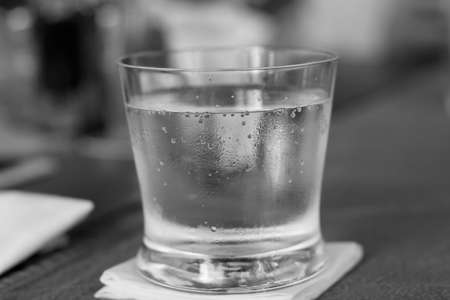 Glass of water black and white photo. Outdoor shot using natural light.の写真素材