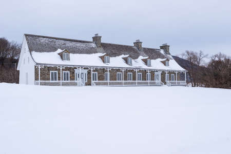 Saint-Joachim, Quebec, Canada â January 29, 2022: The old farm where are the administration of the Cap-Tourmente National Wildlife Area situated on the Beaupre coast at Saint-Joachim (Quebec, Canada).のeditorial素材