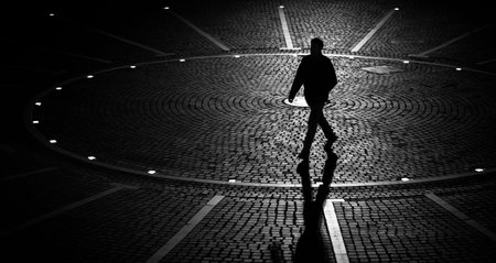 Dark figure walking in the nightの写真素材