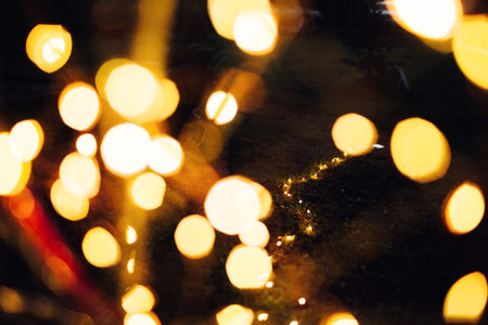 Christmas lights on bike background texture in cityの写真素材