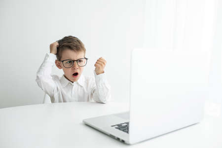 Young businessman working with laptop at officeの写真素材