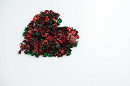 Flowers composition. Frame made of dried rose flowers on white background. Flat lay, top view, copy spaceの写真素材