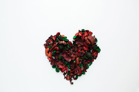 Flowers composition. Frame made of dried rose flowers on white background. Flat lay, top view, copy...