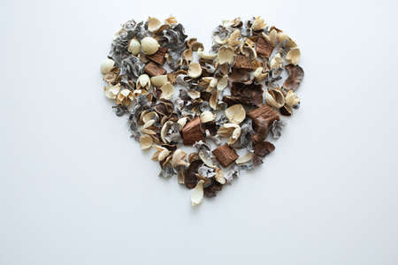 Flowers composition. Frame made of dried rose flowers on white background. Flat lay, top view, copy spaceの写真素材