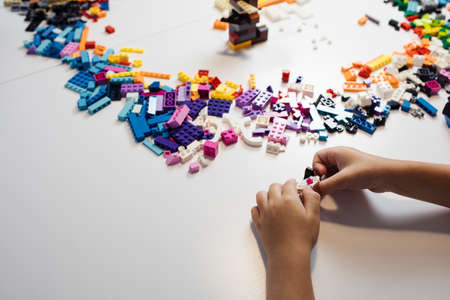 Moscow, The Russia - September 24, 2019: Children hands play with lego blocksのeditorial素材