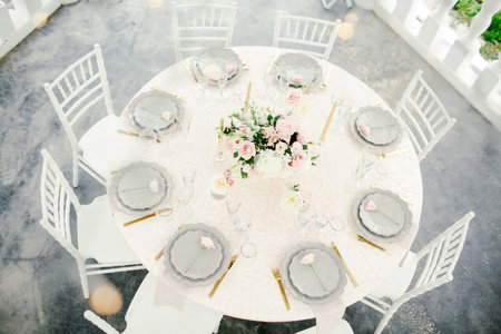 Amazing wedding table decoration with flowers on wooden tables for wedding dinner