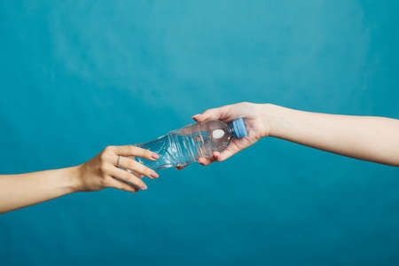 Hand transfers water to the other handの写真素材