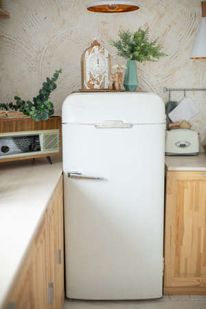 Bright and cozy kitchen in pastel color. The kitchen is decorated in Christmas decorの写真素材