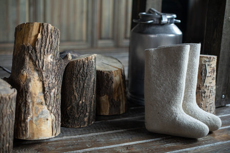 Russian boots on the wooden floor next to the stumps