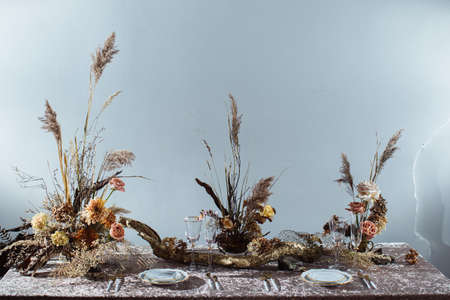 Pink tablecloth, plates. Luxury dinner-Banquet in the restaurant. Beautiful and exquisite autumn wedding decoration.の写真素材