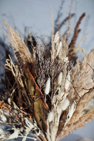 Beautiful autumn bouquet of mixed branches. The job of a floristの写真素材