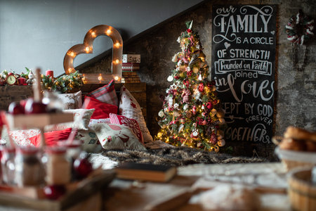 Christmas tree in a beautifully decorated house with Christmas gifts under itの写真素材