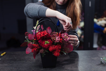 Beautiful bouquet of mixed flowers with peonies. The work of the florist. Flower deliveryの写真素材