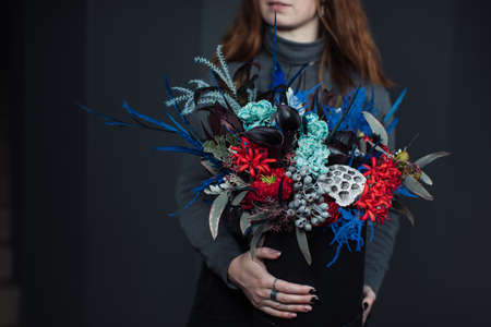 Beautiful bouquet of mixed flowers with peonies. The work of the florist. Flower deliveryの写真素材