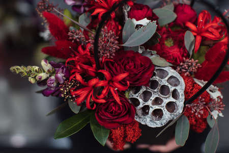 Beautiful bouquet of mixed flowers with peonies. The work of the florist. Flower deliveryの写真素材