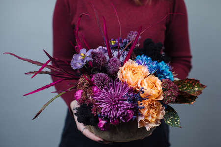 Beautiful bouquet of mixed flowers with peonies. The work of the florist. Flower deliveryの写真素材