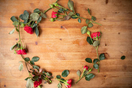 Beautiful flowers on the wooden table. The work of the florist. Flower deliveryの写真素材