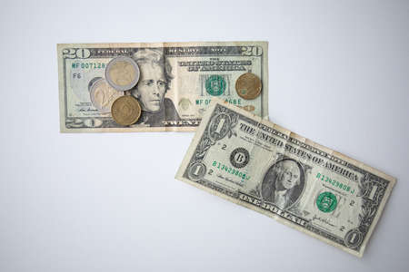 Euro coins and US Dollar banknotesの写真素材