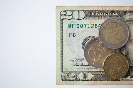 Euro coins and US Dollar banknotesの写真素材