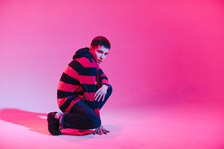 Young Man in a Jumper Dancing Contemporary Dance in Studio. Breakdancing. Dance School Poster. Copy...