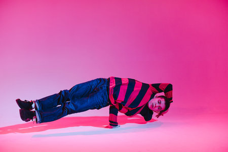 Young Man in a Jumper Dancing Contemporary Dance in Studio. Breakdancing. Dance School Poster. Copy...