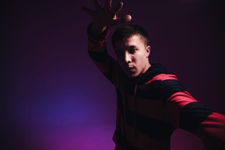 Young Man in a Jumper Dancing Contemporary Dance in Studio. Breakdancing. Dance School Poster. Copy...