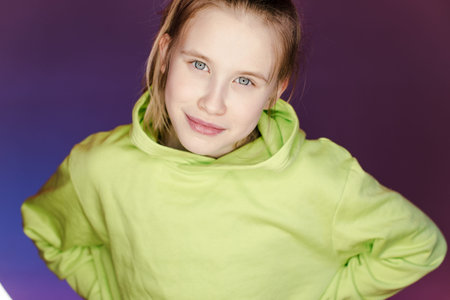 Young stylish girl in the Studio on a colored neon background. Music dj poster design. Portrait of a...