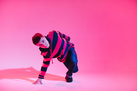 Young Man in a Jumper Dancing Contemporary Dance in Studio. Breakdancing. Dance School Poster. Copy...