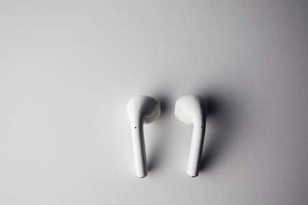 Close-up of a portable headphones on a blue backgroundの写真素材