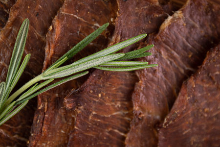 Close-up of a piece of meat on a wooden Board with spices. Restaurant menu, a series of photos of different dishesの写真素材