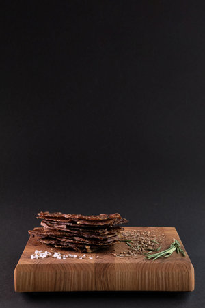 Close-up of a piece of meat on a wooden Board with spices. Restaurant menu, a series of photos of different dishesの写真素材