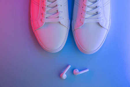 Pair of sneakers on color background, top viewの写真素材