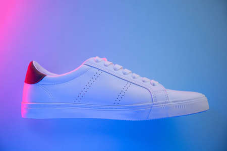 Pair of sneakers on color background, top viewの写真素材