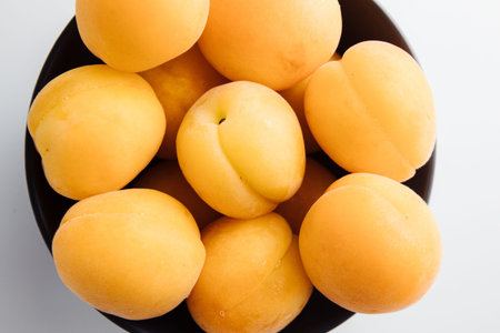 Close-up of ripe peaches on the table. Ripe peaches with leaves