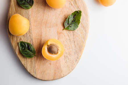 Close-up of ripe peaches on the table. Ripe peaches with leaves. High quality photoの写真素材