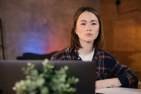 Asian girl freelancer working on a laptop
