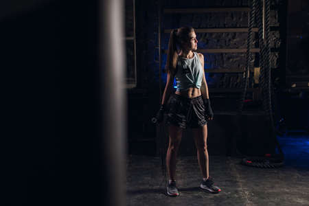 Young girl stands in an atmospheric gym. Sportの写真素材