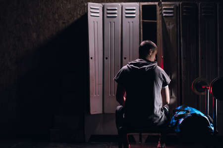 Man get ready for boxing training in the locker roomの写真素材